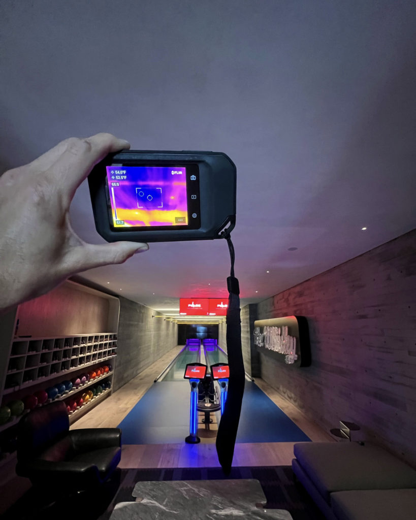 A radiant ceiling over a residential bowling alley providing efficient hydronic cooling via Ray Magic® radiant ceiling panels.