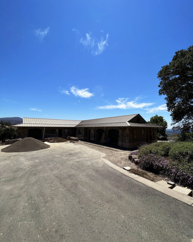 Exterior of home and guest house that utilize a radiant ceiling system for heating and cooling.