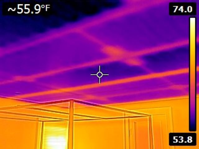 Bedroom with chilled ceiling to provide cooling.