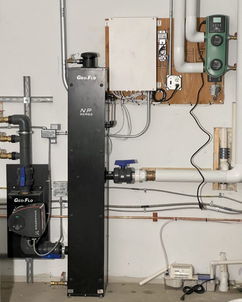 Messana mBox in a mechanical room for hydronic heating and cooling via fan coils and a radiant floor.