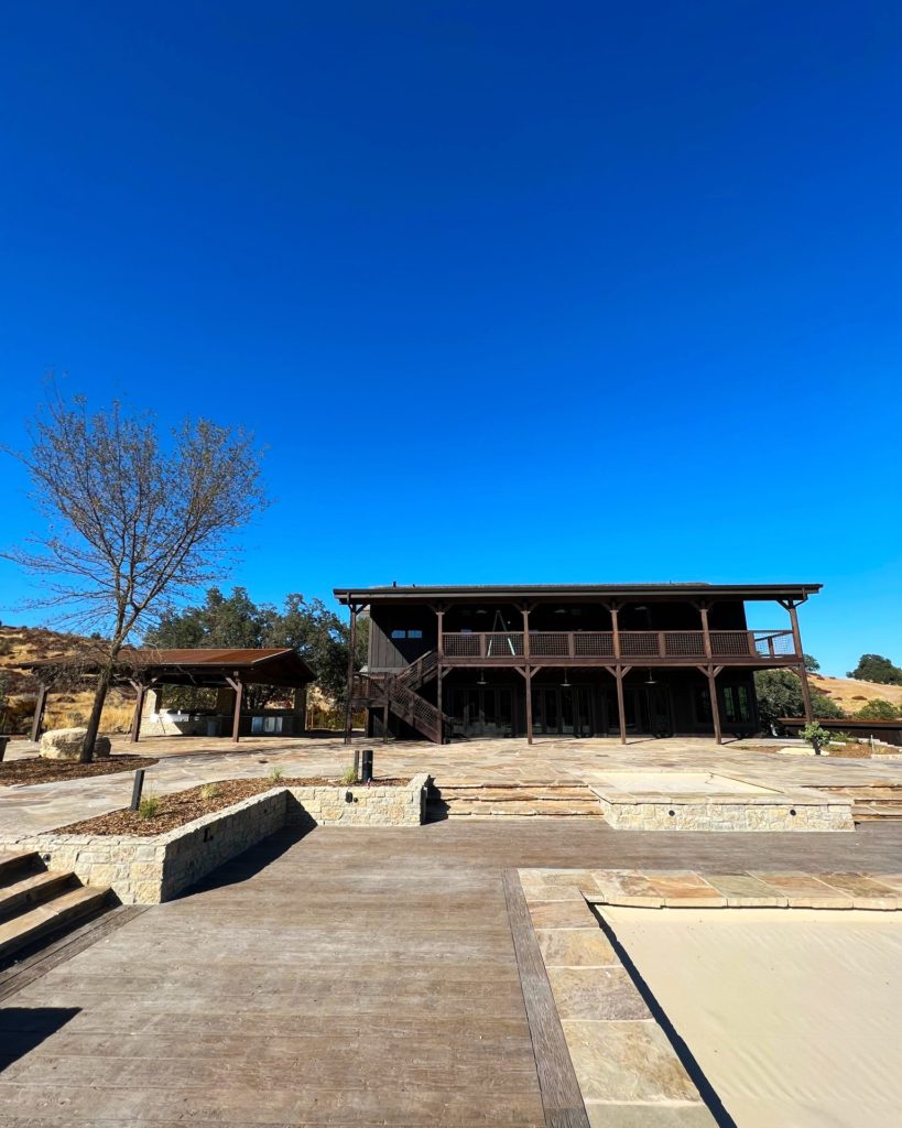 Exterior of ranch home in Bradley, CA that relies on hydronic heating and cooling.