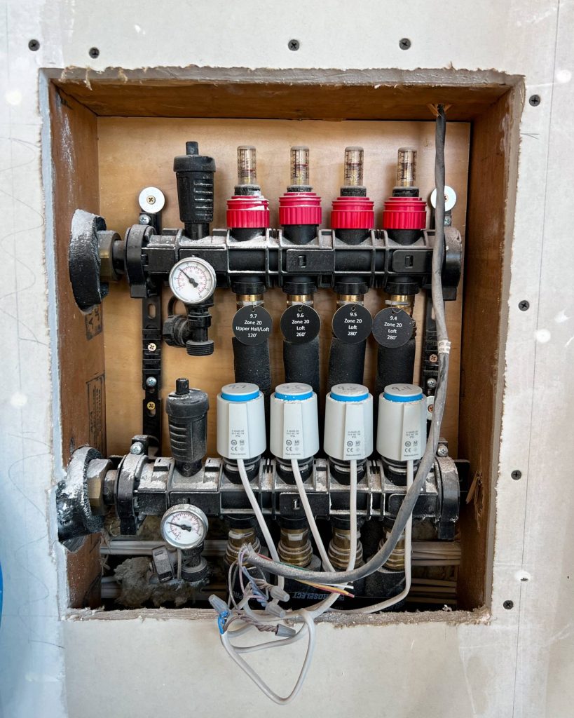 4 loop plastic manifold used for hydronic heating and cooling.