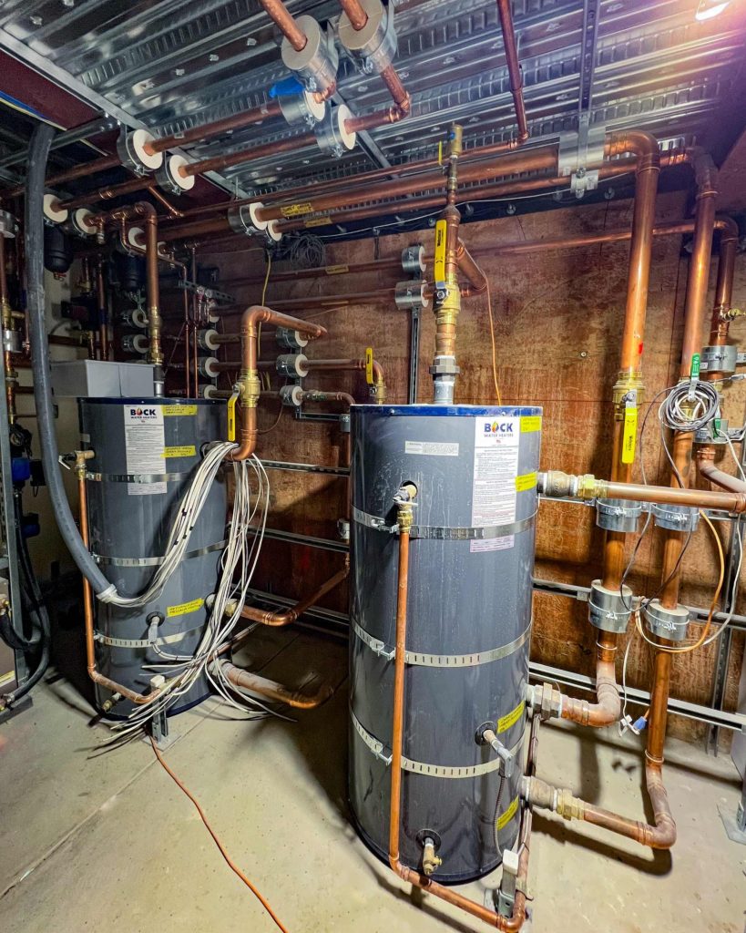 Two buffer tanks used to store hot and cold water for radiant cooling and heating.