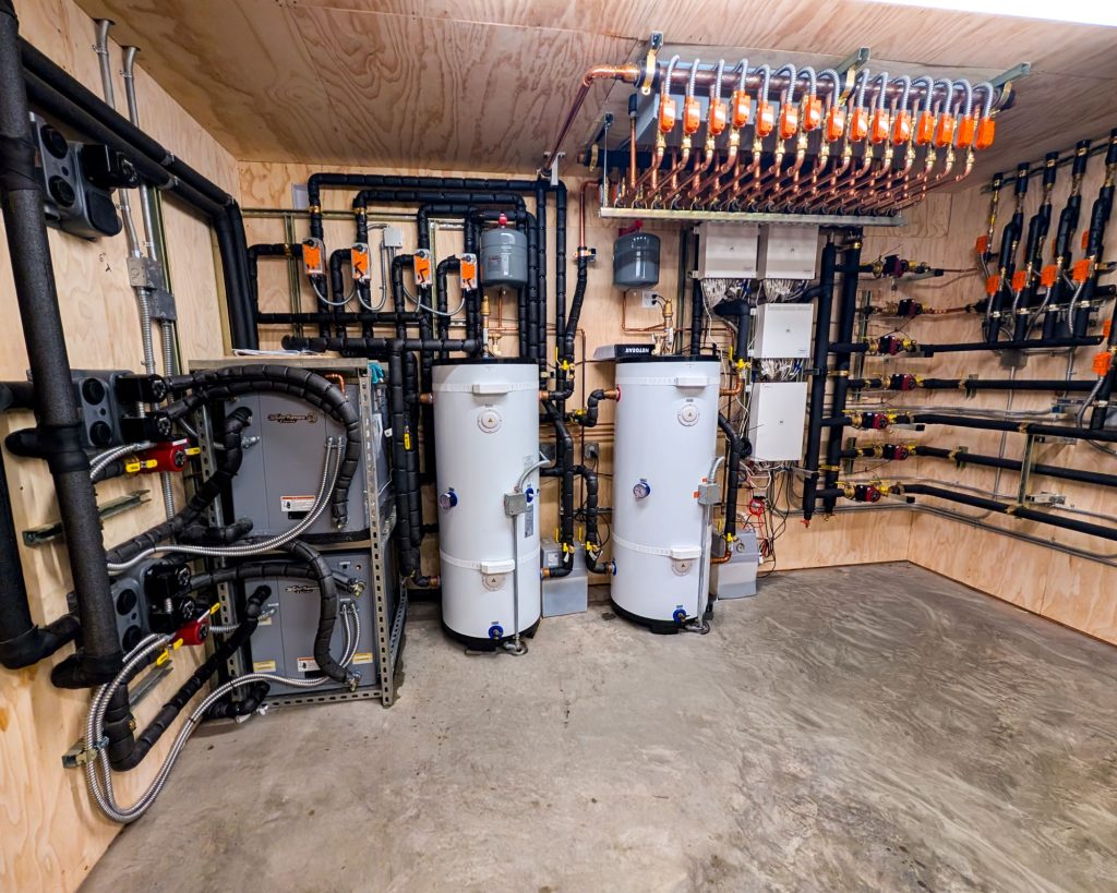 A mechanical room for a Jaga FCU 4-pipe hydronic system